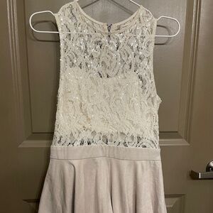beige lace skirt romper with sequins